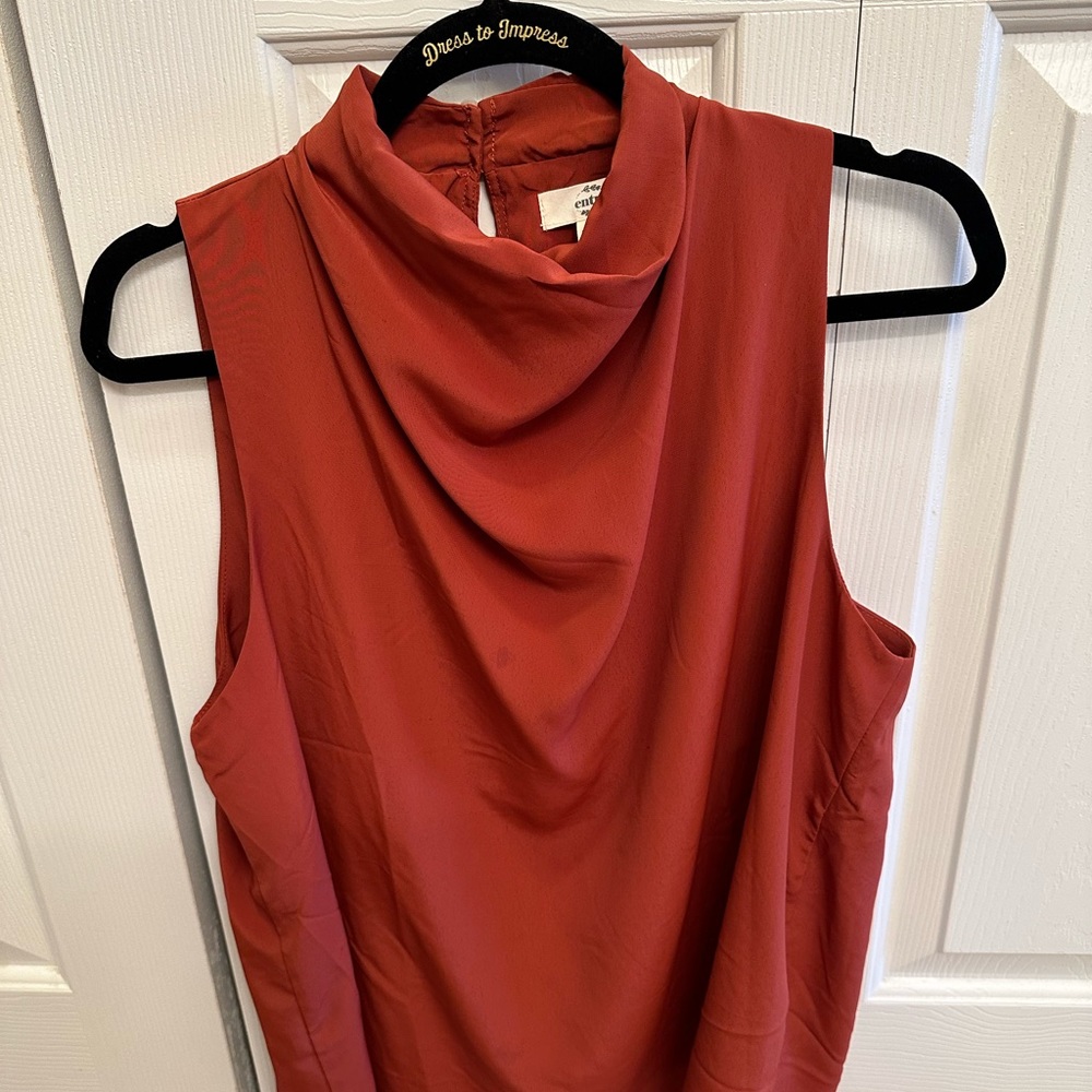 Entro rust colored silky sleeveless blouse. Size L.
